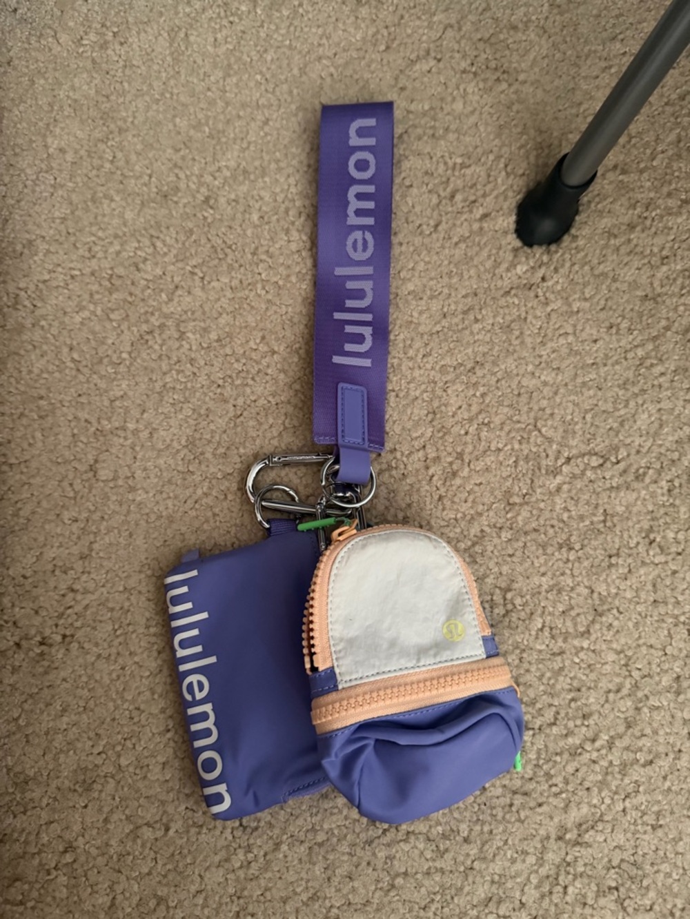 lululemon purple wristlet keychain with peach and white accents